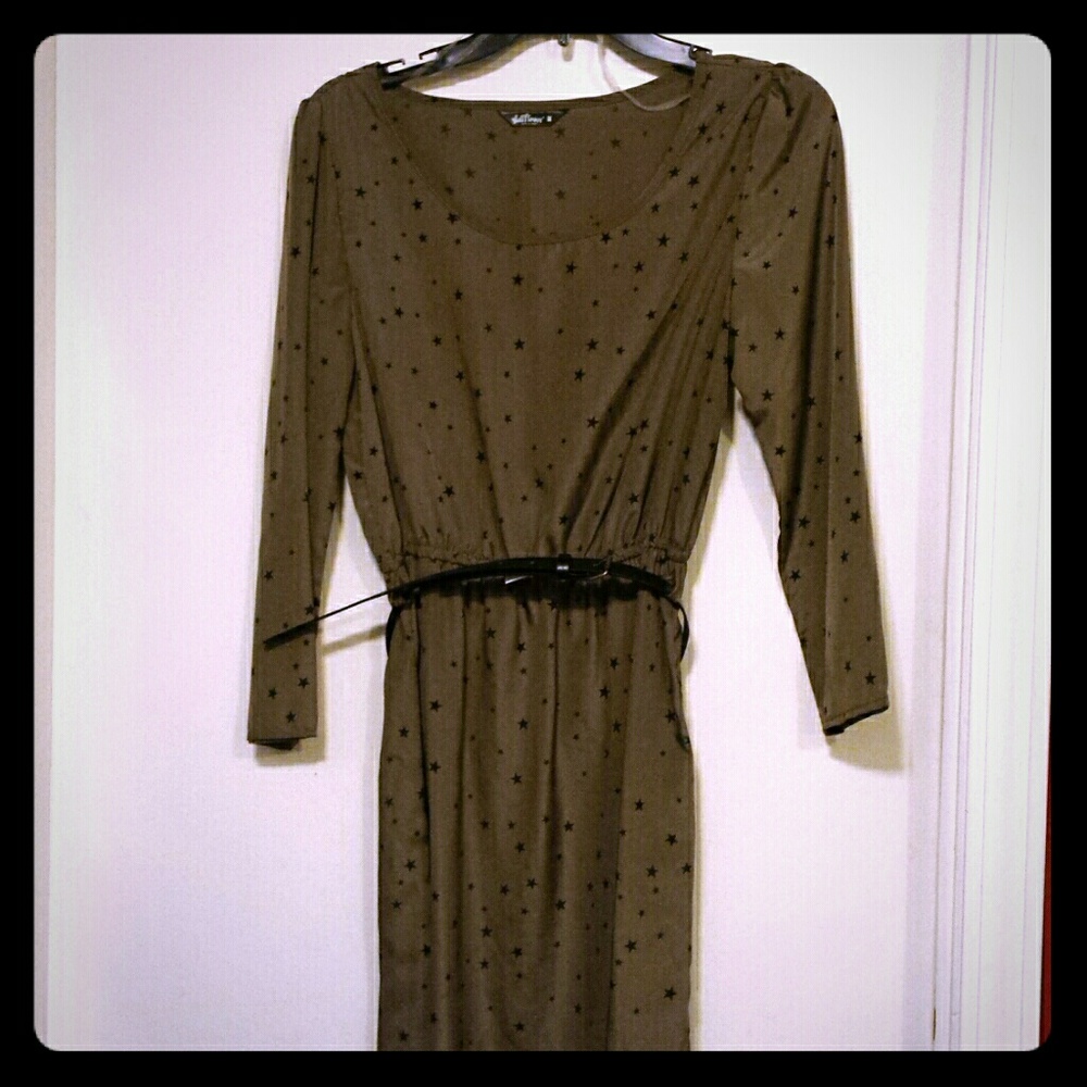 Olive colored belted blouse with black stars.